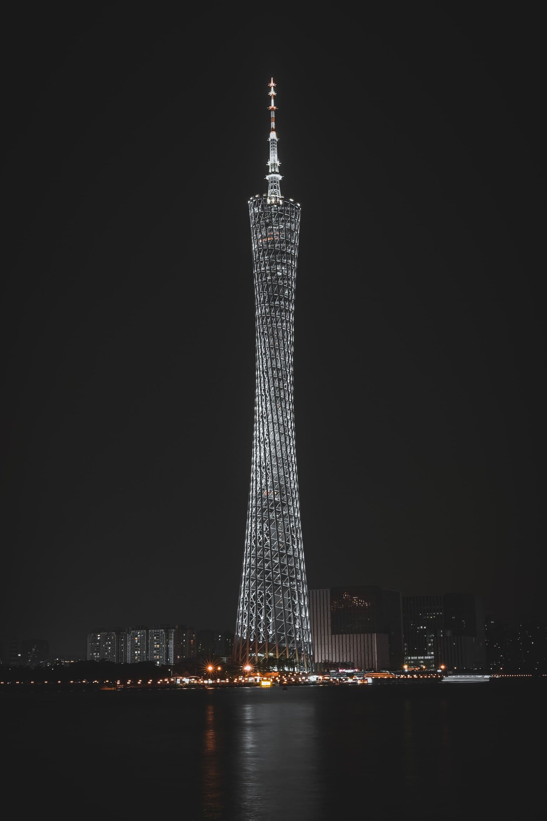The illuminated Canton Tower in Guangzhou at night, across the water